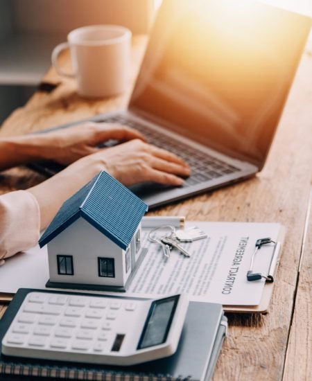 Real estate broker agent presenting and consult to customer to decision making sign insurance form agreement, buy and sell home model, concerning mortgage loan offer for and house insurance
